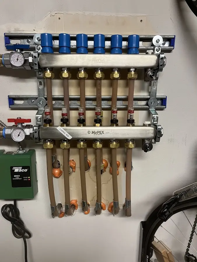 Plumber performing Water Heater Repair at a residential property in Erwin